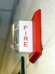 Fire alarm mounted to wall
